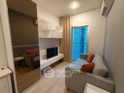 Modern living room with cozy sofa and city view from window