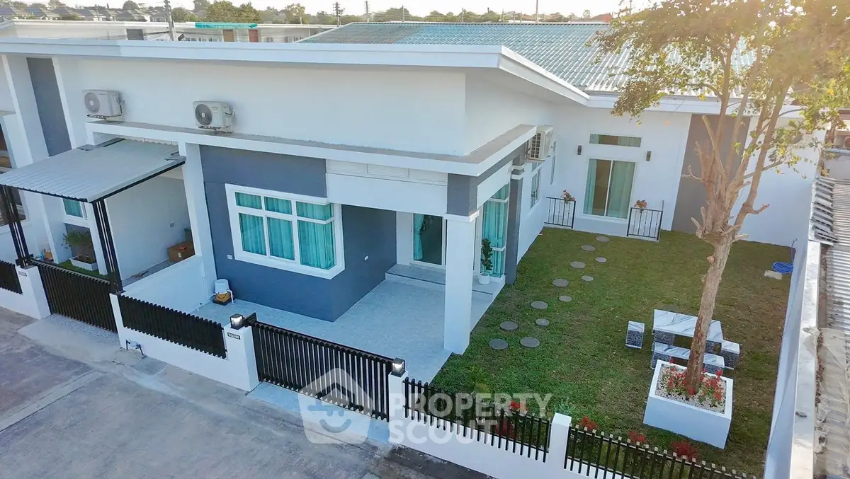 Modern single-story home with spacious yard and sleek design