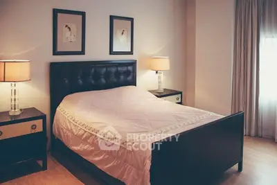 Cozy bedroom with elegant decor and soft lighting, perfect for relaxation.