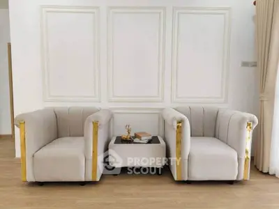 Elegant living room with plush armchairs and stylish decor