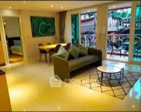 Spacious living room with modern decor and balcony view