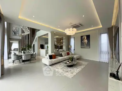 Luxurious open-plan living room with modern decor and elegant lighting in a spacious home.