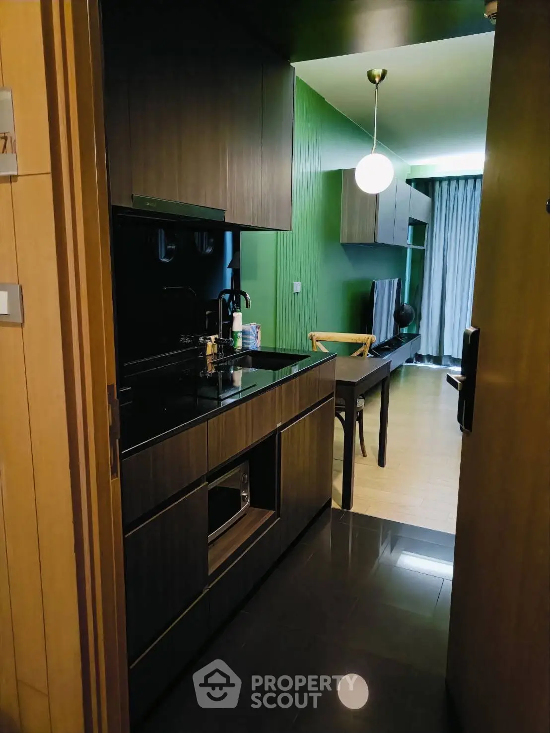 Modern kitchen with sleek design and ample lighting