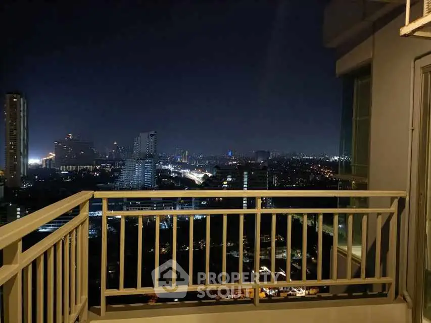 Stunning night cityscape view from a high-rise balcony, perfect for urban living enthusiasts.