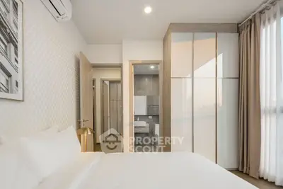 Modern bedroom with ensuite bathroom and large window