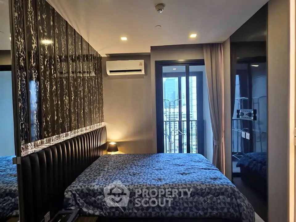Modern bedroom with stylish decor and city view balcony
