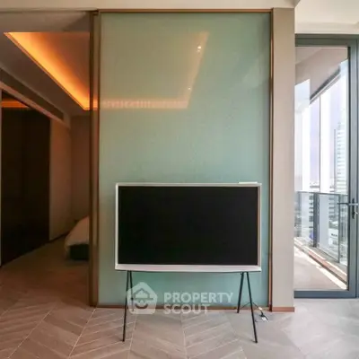 Modern apartment interior with stylish TV stand and balcony view