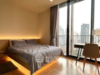 Modern bedroom with city view and stylish decor in high-rise apartment