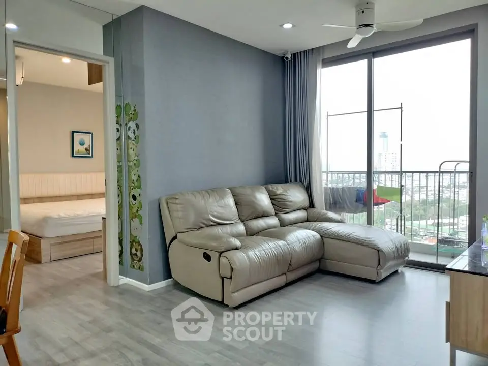 Modern living room with leather sofa and balcony view in a stylish apartment
