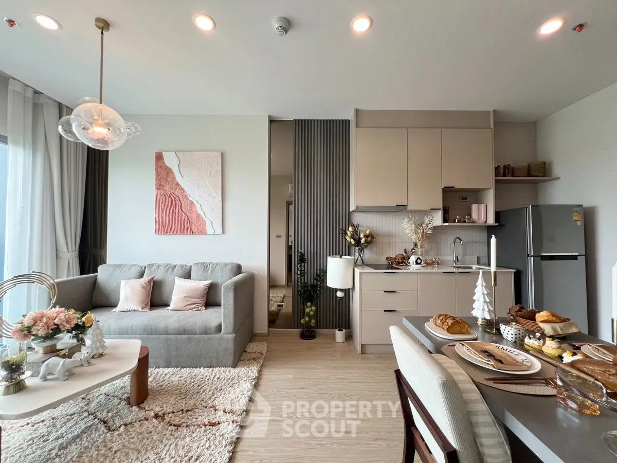 Modern open-plan living room and kitchen with stylish decor and dining setup
