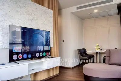 Modern living room with stylish TV setup and cozy seating area
