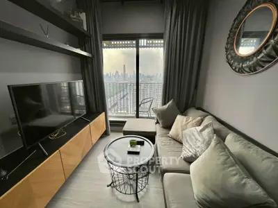 Modern living room with city view, stylish decor, and cozy seating area.