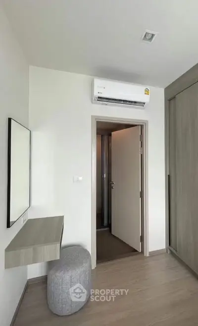 Modern minimalist room with air conditioning and sleek furniture