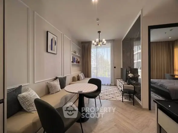 Modern living room with elegant decor and natural light in a stylish apartment