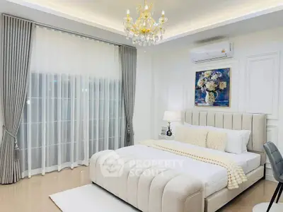 Luxurious bedroom with elegant chandelier and modern decor