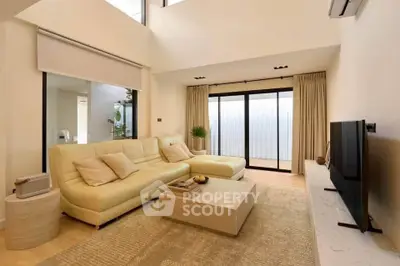 Luxurious modern living room with elegant beige sofa and large TV