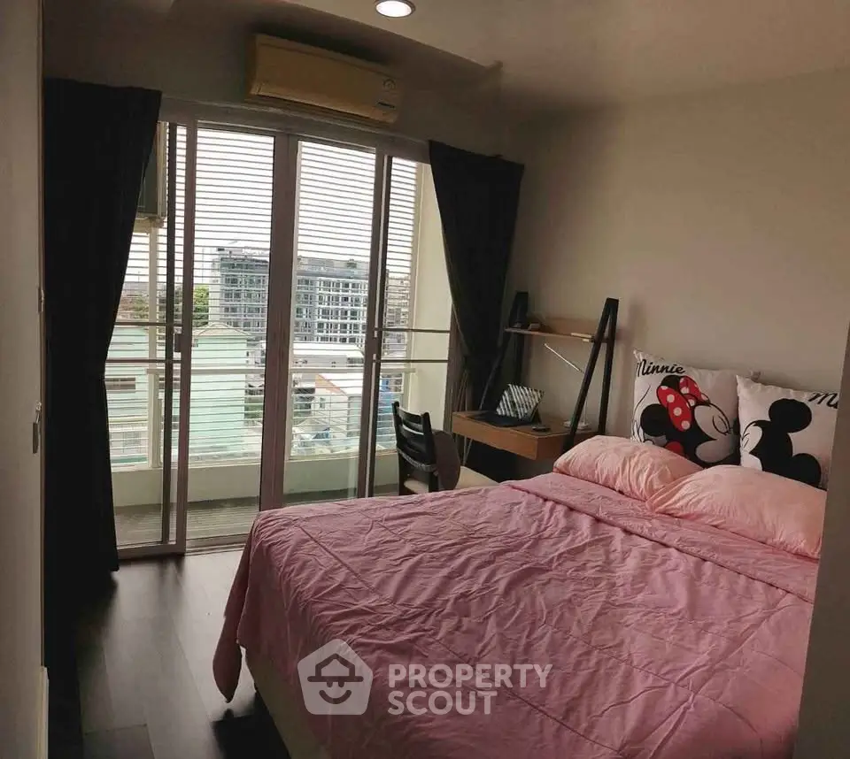 Cozy bedroom with balcony view in modern apartment