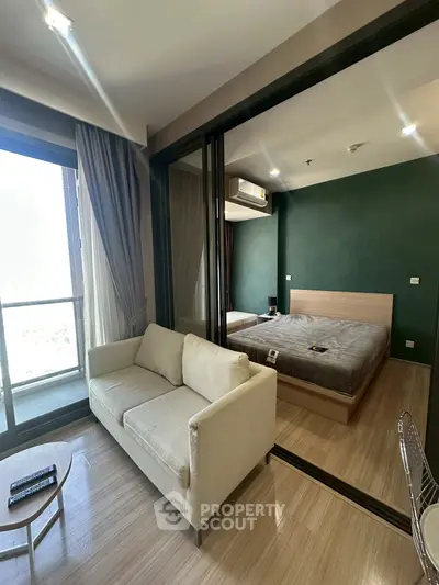 Modern apartment with glass partitioned bedroom and cozy living area