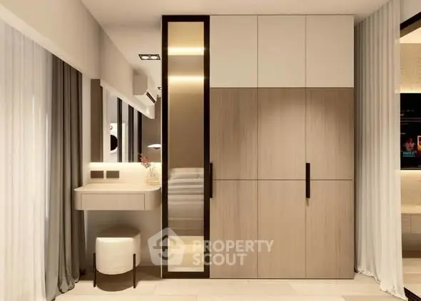 Modern bedroom with sleek wardrobe and elegant vanity area