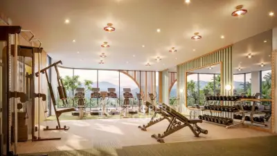 Luxurious gym with modern equipment and scenic views, perfect for fitness enthusiasts seeking a premium workout space.