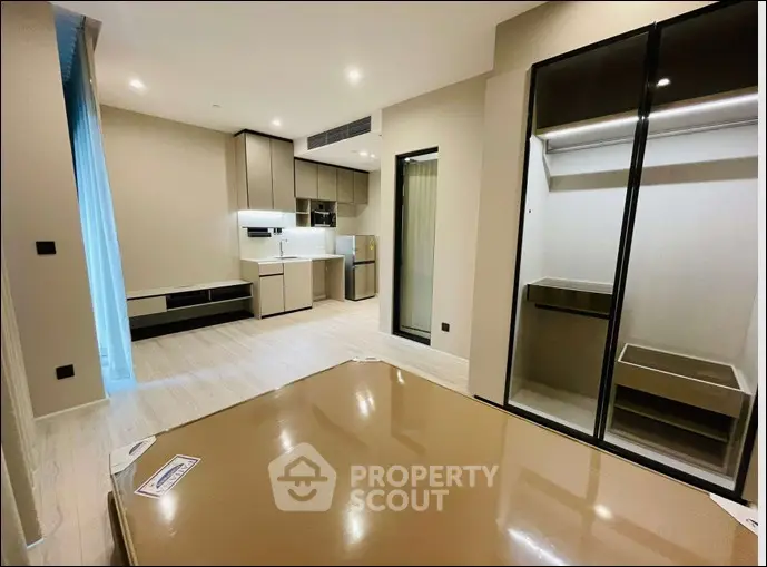 Modern apartment interior with open kitchen and spacious living area