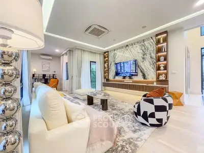 Luxurious modern living room with elegant decor and marble accent wall, perfect for stylish entertaining.