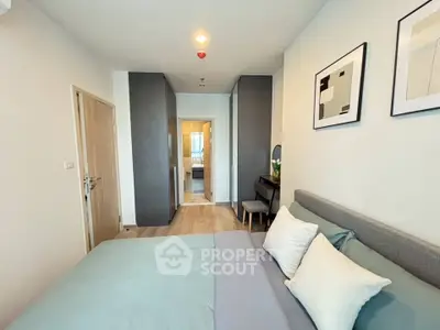 Modern bedroom with stylish decor and cozy ambiance in a contemporary apartment.
