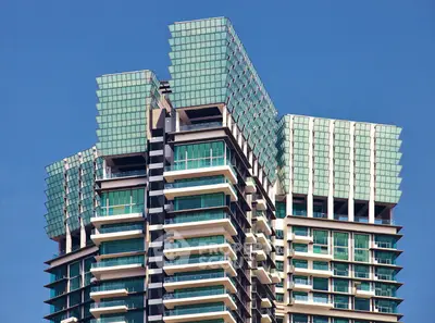 Stunning modern high-rise building with unique architectural design and glass facade.