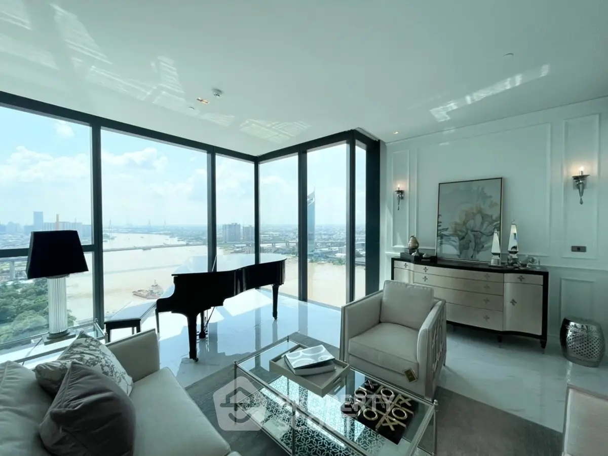 Luxurious living room with panoramic city and river views, featuring elegant furniture and a grand piano.