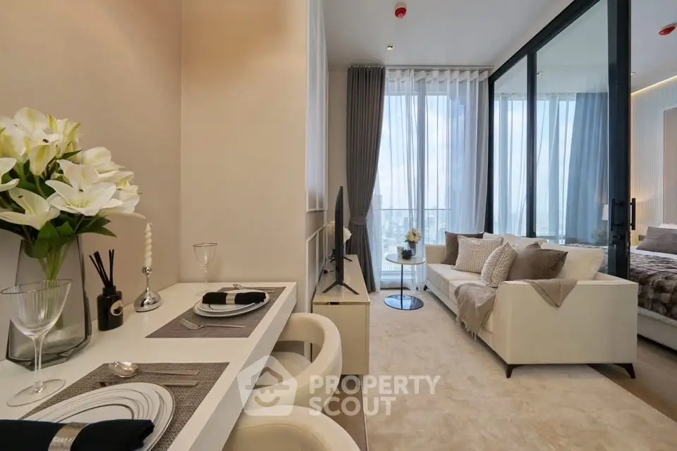 Luxurious modern living room with elegant decor and large windows offering stunning city views.