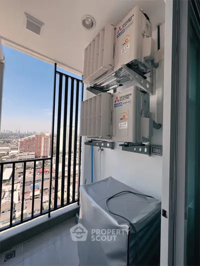 Modern balcony with city view and air conditioning units, perfect for urban living.