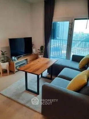 Modern living room with cozy sofa and city view balcony