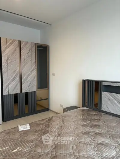 Modern bedroom with stylish wardrobe and elegant decor