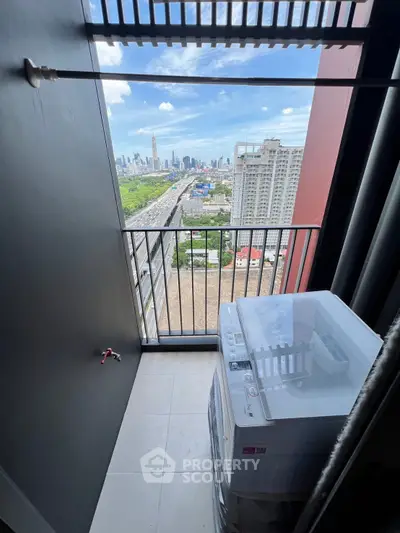 High-rise balcony with washing machine and stunning city skyline view