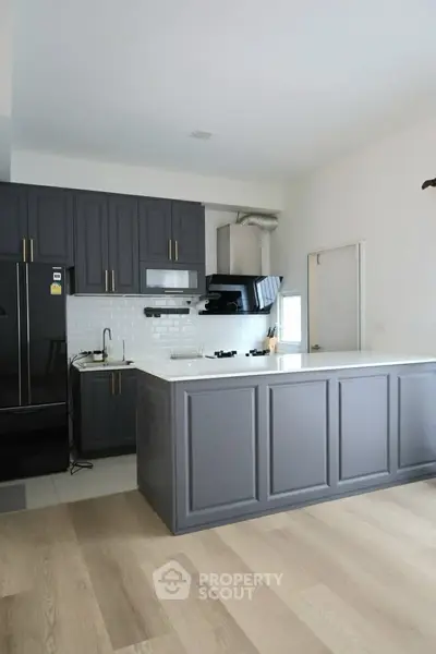 Modern kitchen with sleek cabinetry and open layout design