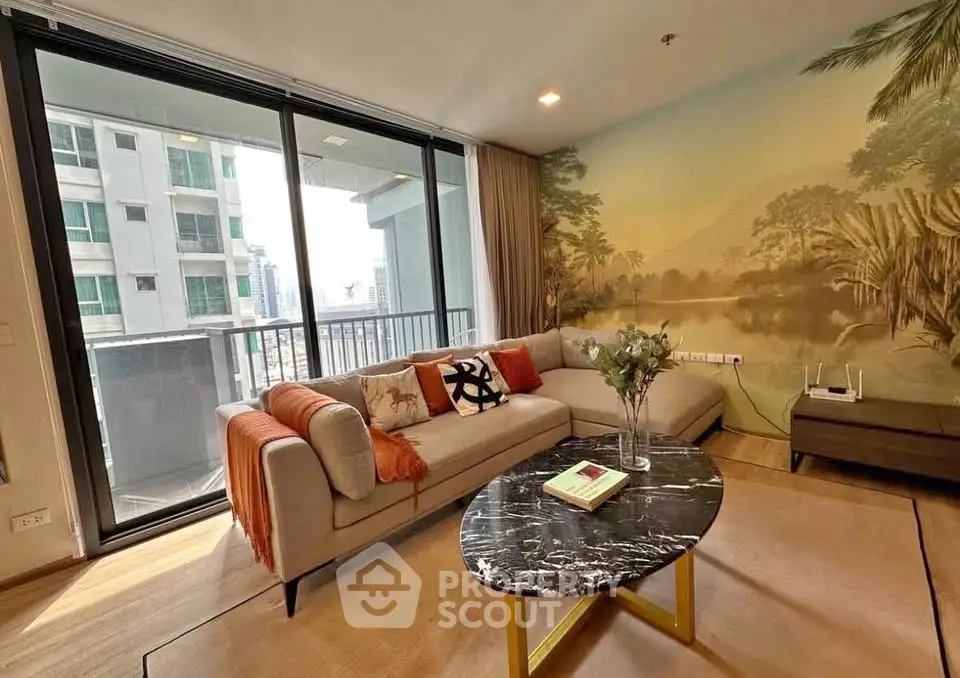 Stylish living room with large windows and balcony in modern apartment