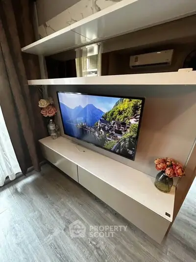 Modern living room with sleek TV unit and elegant decor