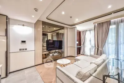 Luxurious modern living room with elegant decor and large windows