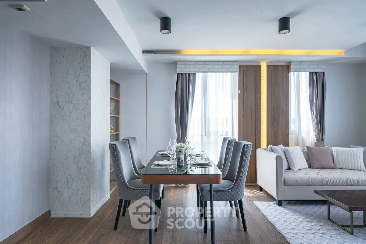Modern living room with elegant dining area and stylish decor