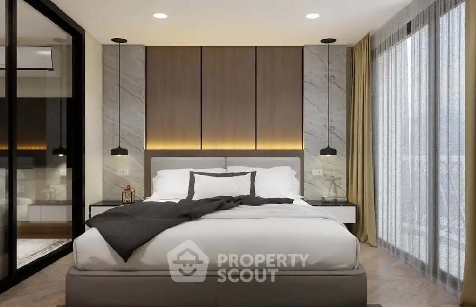 Luxurious modern bedroom with elegant decor and large windows for natural light.