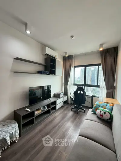 Modern living room with city view, sleek furniture, and cozy decor in a high-rise apartment.