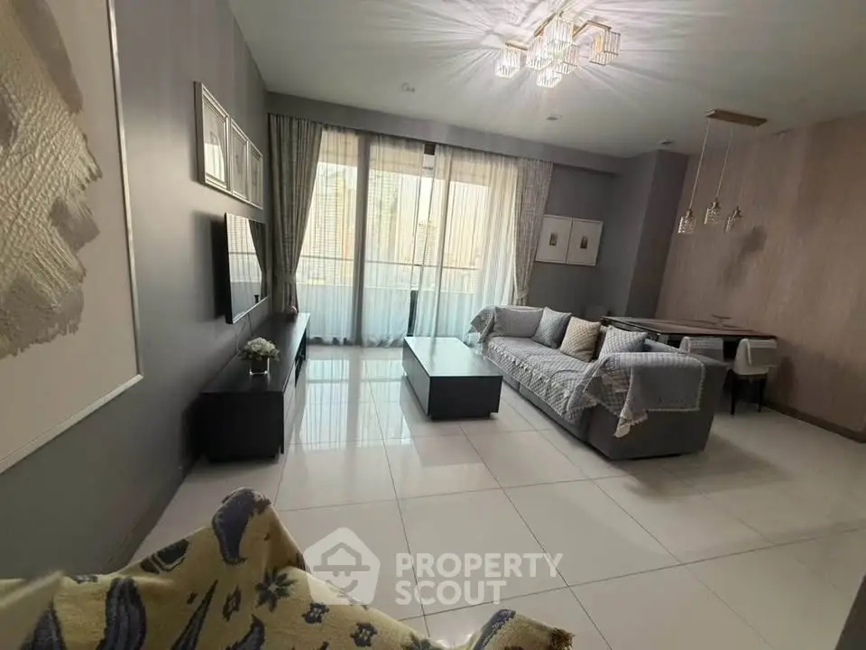 Spacious modern living room with elegant decor and large windows for natural light.