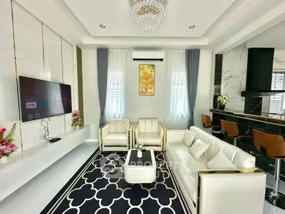 Luxurious modern living room with elegant decor and stylish furniture, perfect for sophisticated living.