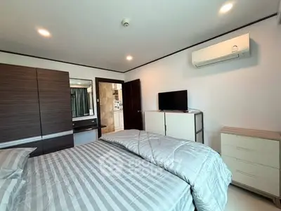 Modern bedroom with air conditioning and stylish furniture in a cozy apartment.