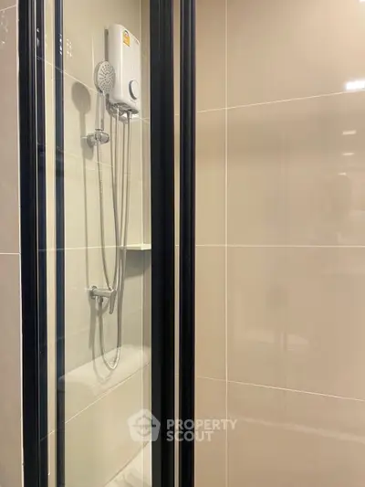Modern bathroom with sleek shower enclosure and water heater