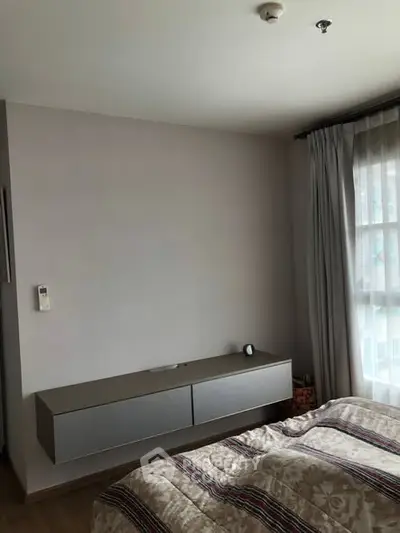 Cozy bedroom with modern decor and natural light