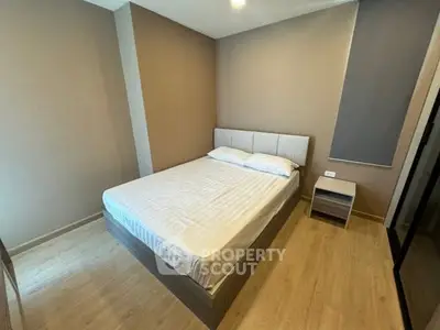 Cozy bedroom with modern design and wooden flooring