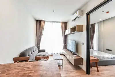 Modern living room with stylish furniture and natural light in a contemporary apartment.