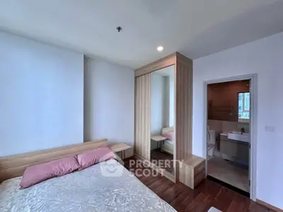 Modern bedroom with ensuite bathroom and stylish wooden furniture