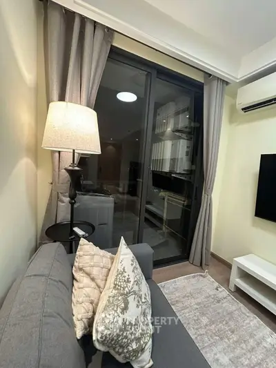 Cozy living room with modern decor and balcony view